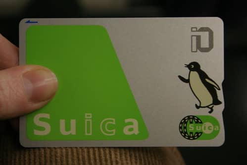 A Suica Card (or "watermelon card") is a must have public transit card for traveling in Japan.